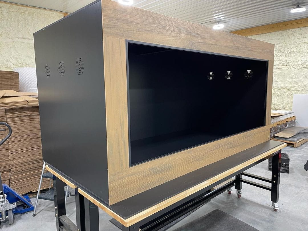 Ball python enclosure with hides, substrate and habitat enrichment